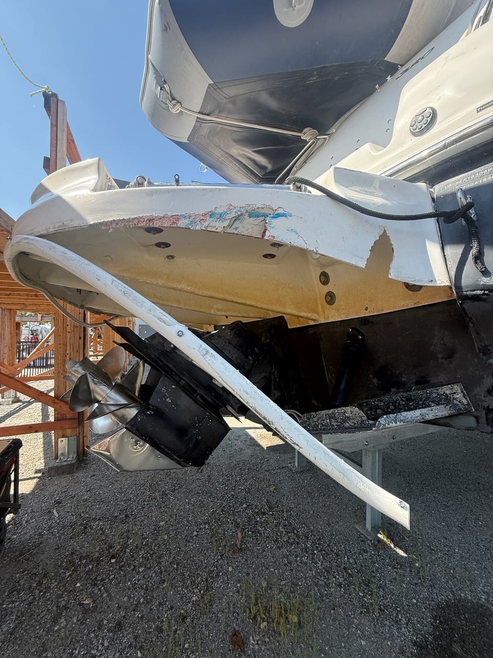 Extensive impact and surface damage across a boat stern platform before Waterline repair